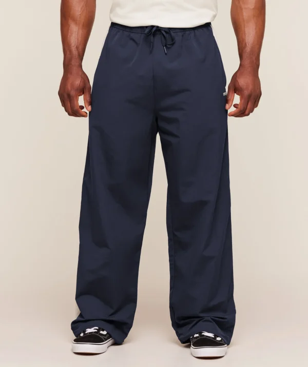 GYMSHARK RETRO COLLEGIATE TRACK PANTS – HEAVY BLUE / TINTED WHITE